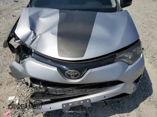 2018 Toyota RAV4 XLE with VIN 2T3WFREVXJW427748, listed as a Copart auction lot 61833055 with 104,057 mi miles and Salvage title. Bid and sale history available at DreamBid. Image 12.