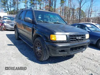 1998 Isuzu Rodeo S z VIN 4S2CK58W2W4315935, wystawiony jako IAAI lot #41593711 z przebiegiem 162 065 mil mil oraz . Historia ofert i sprzedaży dostępna na DreamBid. Obrazek 1.