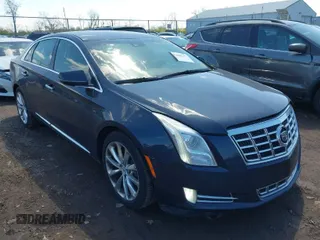 2013 Cadillac XTS Luxury with VIN 2G61P5S33D9162806, listed as a IAAI auction lot 42060777 with 168,896 mi miles. Bid and sale history available at carsss.com. Image 1.