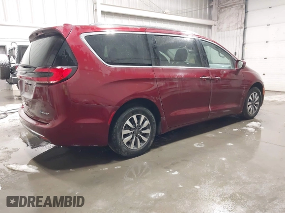 2021 Chrysler Pacifica Hybrid Touring L with VIN 2C4RC1L71MR581260, listed as a IAAI auction lot 42014401 with 68,719 mi miles and . Bid and sale history available at DreamBid. Image 4.