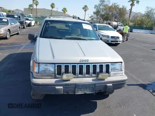 1994 Jeep Grand Cherokee Laredo with VIN 1J4GZ58S4RC325909, listed as a IAAI auction lot 39580601 with 162,952 mi miles. Bid and sale history available at carsss.com. Image 6.