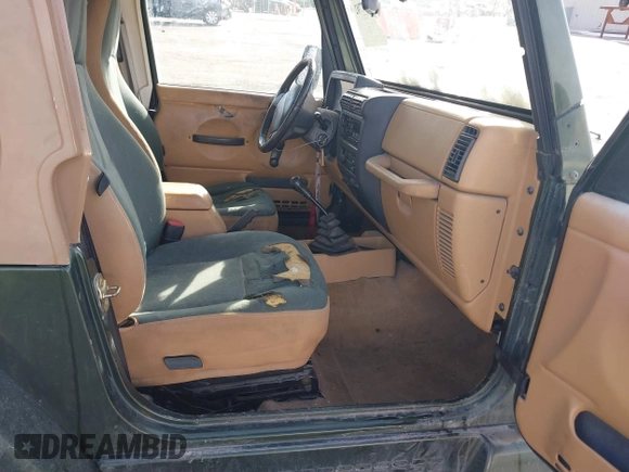 1998 Jeep Wrangler Sahara z VIN 1J4FY49S3WP744619, wystawiony jako IAAI lot #41107702 z przebiegiem 105 432 mil mil oraz . Historia ofert i sprzedaży dostępna na DreamBid. Obrazek 5.