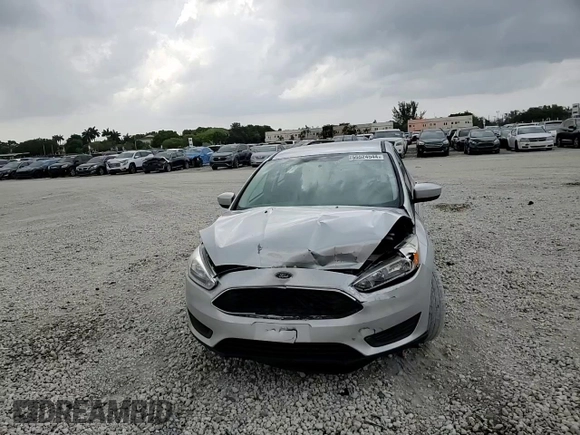 2018 Ford Focus SE with VIN 1FADP3F28JL256318, listed as a Copart auction lot 55524544 with 136,723 mi miles and Salvage title. Bid and sale history available at DreamBid. Image 10.