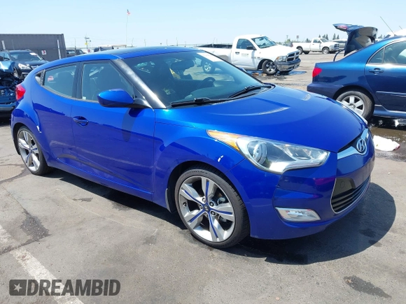 2013 Hyundai Veloster w/Black Int with VIN KMHTC6AD6DU143974, listed as a IAAI auction lot 42164745 with 136,195 mi miles and . Bid and sale history available at DreamBid. Image 1.