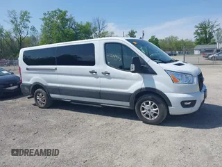 2021 Ford Transit Passenger XL z VIN 1FBAX2Y84MKA14973, wystawiony jako IAAI lot #42149017 z przebiegiem 105 171 mil mil oraz . Historia ofert i sprzedaży dostępna na DreamBid. Obrazek 14.