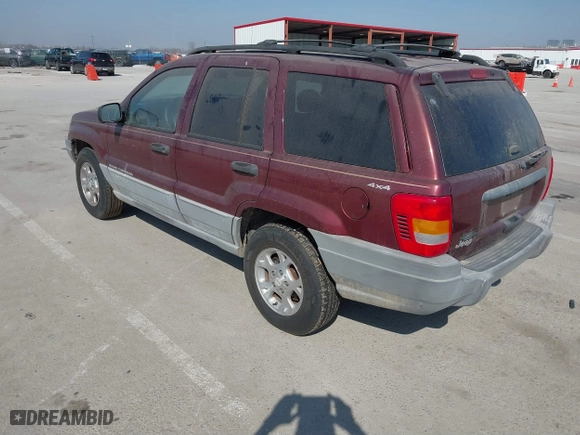 1999 Jeep Grand Cherokee Laredo with VIN 1J4GW58S6XC554582, listed as a IAAI auction lot 41780284 with 183,156 mi miles. Bid and sale history available at carsss.com. Image 3.