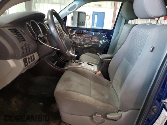 2015 Toyota Tacoma with VIN 3TMLU4EN6FM186016, listed as a Copart auction lot 58404675 with 127,536 mi miles and Salvage title. Bid and sale history available at DreamBid. Image 7.