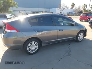 2010 Honda Insight LX with VIN JHMZE2H50AS019740, listed as a IAAI auction lot 41665527 with 74,022 mi miles and . Bid and sale history available at DreamBid. Image 4.