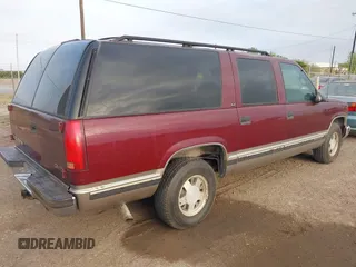 1999 GMC Suburban with VIN 1GKEC16R3XJ707787, listed as a IAAI auction lot 41826640 with 175,437 mi miles. Bid and sale history available at carsss.com. Image 4.