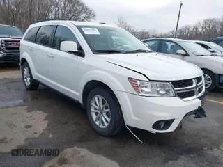 2016 Dodge Journey SXT with VIN 3C4PDCBG0GT206463, listed as a IAAI auction lot 41832864 with 135,409 mi miles. Bid and sale history available at carsss.com. Image 1.