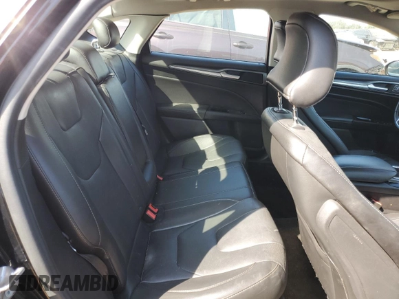 2016 Ford Fusion Titanium z VIN 3FA6P0K98GR151640, wystawiony jako Copart lot #73254594 z przebiegiem 145 473 mil mil oraz Szkoda całkowita • Salvage title. Historia ofert i sprzedaży dostępna na DreamBid. Obrazek 10.