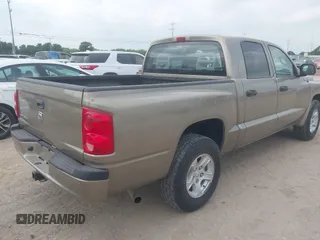 2006 Dodge Dakota SLT with VIN 1D7HE48N16S703072, listed as a IAAI auction lot 42156709 with 102,919 mi miles. Bid and sale history available at carsss.com. Image 4.
