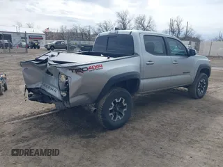 2023 Toyota Tacoma 4WD SR with VIN 3TMCZ5AN0PM609672, listed as a IAAI auction lot 41830191 with 24,244 mi miles. Bid and sale history available at carsss.com. Image 4.