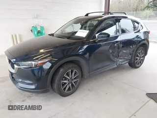 2018 Mazda CX-5 Grand Touring with VIN JM3KFBDM4J0302870, listed as a IAAI auction lot 41934217 with 57,151 mi miles. Bid and sale history available at carsss.com. Image 18.