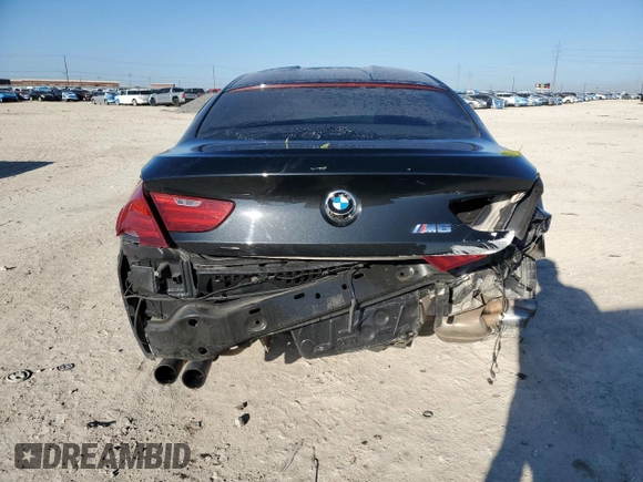 2015 BMW M6 z VIN WBS6C9C5XFD467952, wystawiony jako Copart lot #46312895 z przebiegiem 79 807 mil mil oraz Szkoda całkowita • Salvage title. Historia ofert i sprzedaży dostępna na DreamBid. Obrazek 6.