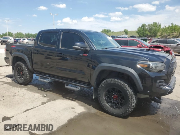 2019 Toyota Tacoma SR with VIN 5TFCZ5ANXKX184626, listed as a Copart auction lot 59220905 with 123,746 mi miles and Salvage title. Bid and sale history available at DreamBid. Image 4.