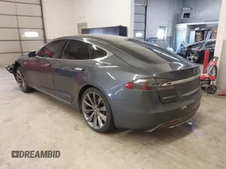 2014 Tesla Model S 60 with VIN 5YJSA1H13EFP49912, listed as a IAAI auction lot 41716661 with 129,776 mi miles and . Bid and sale history available at DreamBid. Image 3.