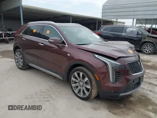 2022 Cadillac XT4 FWD Premium Luxury z VIN 1GYFZCR4XNF116845, wystawiony jako IAAI lot #42128210 z przebiegiem 43 423 mil mil oraz . Historia ofert i sprzedaży dostępna na DreamBid. Obrazek 1.