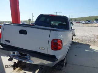 2003 Ford F-150 XLT with VIN 1FTRW08L63KA28964, listed as a IAAI auction lot 41689700 with 303,789 mi miles. Bid and sale history available at carsss.com. Image 4.