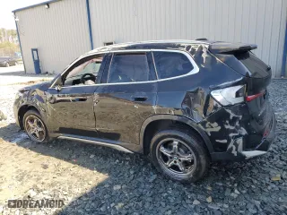 2025 BMW X1 xDrive28i with VIN WBX73EF00S5111795, listed as a Copart auction lot 48765255 with 12,042 mi miles and Salvage Title. Bid and sale history available at carsss.com. Image 2.