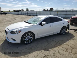 2014 Mazda 6 i Grand Touring с VIN JM1GJ1W63E1130417, выставлен на аукционе Copart как лот 52961595 с пробегом 124 397 миль миль и Списание • Salvage title. История ставок и продаж доступна на DreamBid. Изображение 1.