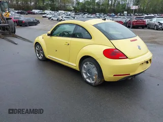 2012 Volkswagen Beetle 2.5L w/Sound/Nav PZEV with VIN 3VWJP7AT4CM613867, listed as a IAAI auction lot 41602806 with 167,004 mi miles. Bid and sale history available at carsss.com. Image 3.