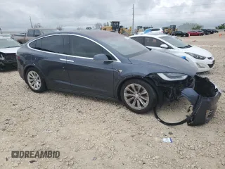 2017 Tesla Model X 90D with VIN 5YJXCBE26HF079246, listed as a Copart auction lot 50141605 with 68,905 mi miles and Salvage Title. Bid and sale history available at DreamBid. Image 4.