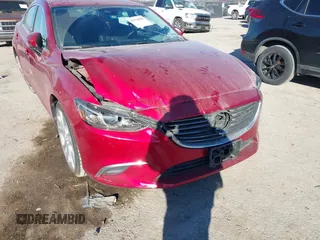2017 Mazda 6 Touring with VIN JM1GL1V51H1126762, listed as a IAAI auction lot 41394606 with 62,072 mi miles and . Bid and sale history available at DreamBid. Image 6.