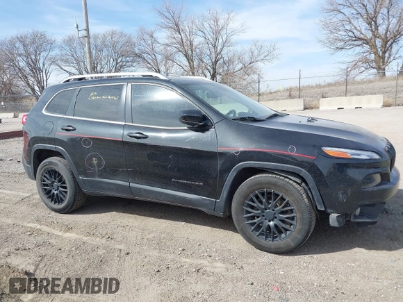 2015 Jeep Cherokee North with VIN 1C4PJMCS7FW544792, listed as a IAAI auction lot 41801573 with 140,575 mi miles. Bid and sale history available at carsss.com. Image 13.