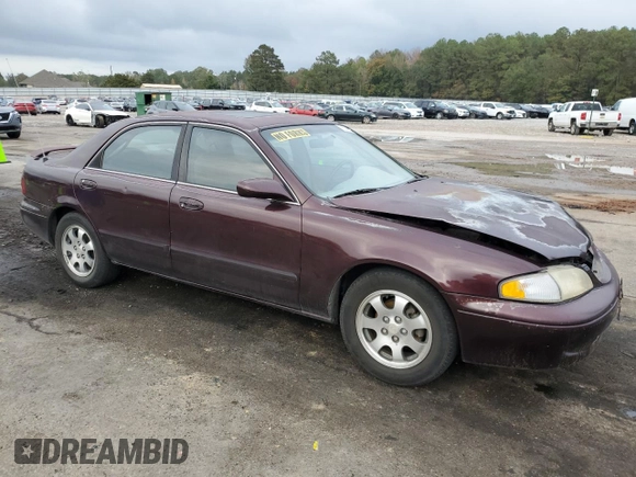 1998 Mazda 626 DX z VIN 1YVGF22CXW5775511, wystawiony jako Copart lot #78748784 z przebiegiem 158 570 mil mil oraz Szkoda całkowita • Salvage title. Historia ofert i sprzedaży dostępna na DreamBid. Obrazek 4.