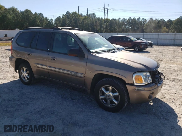 2002 GMC Envoy SLT with VIN 1GKDT13S022456264, listed as a Copart auction lot 76556004 with 230,954 mi miles and Salvage Title. Bid and sale history available at DreamBid. Image 4.