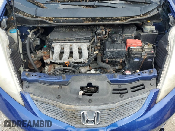 2009 Honda Fit Sport z VIN JHMGE88449S058618, wystawiony jako Copart lot #60717735 z przebiegiem 172 734 mil mil oraz Czysty tytuł • Clean title. Historia ofert i sprzedaży dostępna na DreamBid. Obrazek 11.