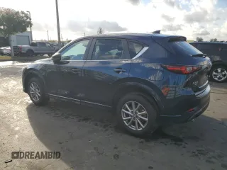 2024 Mazda CX-5 2.5 S Carbon Edition with VIN JM3KFBCL0R0458750, listed as a Copart auction lot 45976215 with 5,194 mi miles and Salvage Title. Bid and sale history available at carsss.com. Image 2.