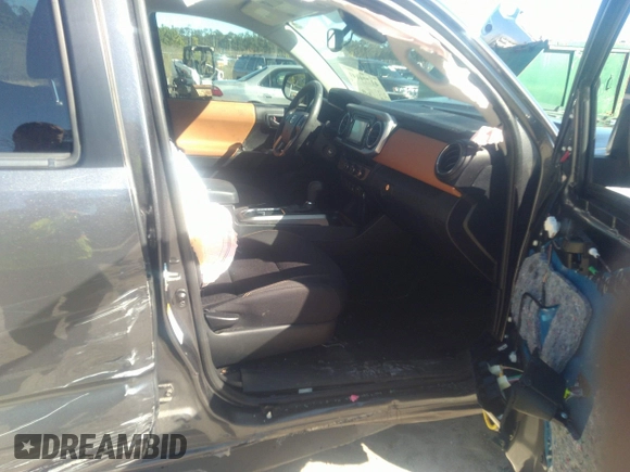 2018 Toyota Tacoma SR5 with VIN 5TFAZ5CN0JX056706, listed as a IAAI auction lot 41774141 with 31,738 mi miles and . Bid and sale history available at DreamBid. Image 5.