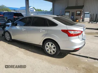 2012 Ford Focus SE with VIN 1FAHP3F29CL161559, listed as a Copart auction lot 61695575 with 127,412 mi miles and Salvage title. Bid and sale history available at DreamBid. Image 2.