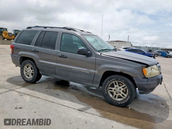 2003 Jeep Grand Cherokee Laredo with VIN 1J4GW48SX3C569087, listed as a Copart auction lot 55941035 with Not provided miles and Salvage title. Bid and sale history available at DreamBid. Image 4.
