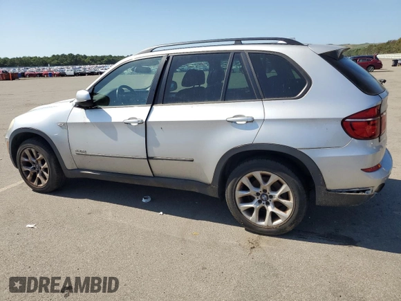 2012 BMW X5 35i with VIN 5UXZV4C5XCL749204, listed as a Copart auction lot 62012985 with 94,636 mi miles and Clean title. Bid and sale history available at DreamBid. Image 2.