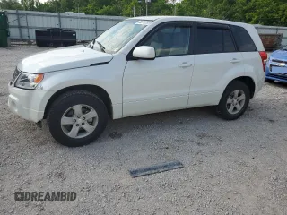 2010 Suzuki Grand Vitara Premium with VIN JS3TD0D24A4100983, listed as a Copart auction lot 60311295 with 104,455 mi miles and Salvage title. Bid and sale history available at DreamBid. Image 1.