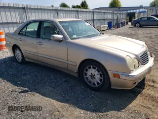 2000 Mercedes-Benz E-Class with VIN WDBJF65J2YB165568, listed as a Copart auction lot 70003994 with 146,518 mi miles and Salvage Title. Bid and sale history available at carsss.com. Image 4.