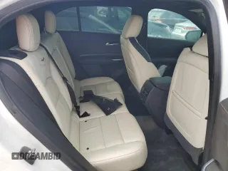 2022 Cadillac XT4 FWD Sport z VIN 1GYFZER44NF118862, wystawiony jako Copart lot #55231775 z przebiegiem 14 983 mil mil oraz Nie do naprawy. Historia ofert i sprzedaży dostępna na DreamBid. Obrazek 11.