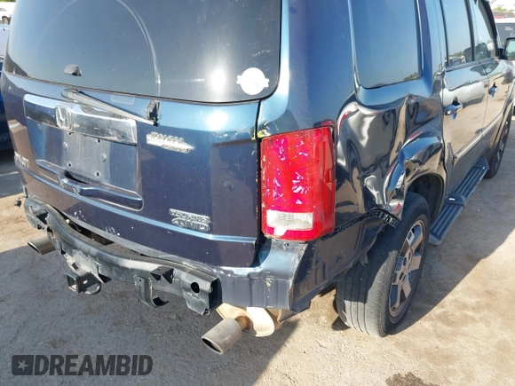 2011 Honda Pilot Touring with VIN 5FNYF4H92BB090056, listed as a IAAI auction lot 42010682 with 201,640 mi miles. Bid and sale history available at carsss.com. Image 17.