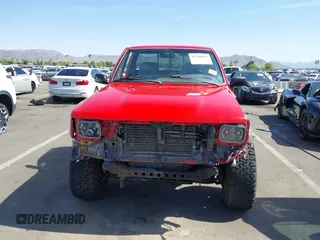 1990 Toyota Pickup DX z VIN JT4RN01P7L7019709, wystawiony jako IAAI lot #42448995 z przebiegiem 144 469 mil mil oraz . Historia ofert i sprzedaży dostępna na DreamBid. Obrazek 13.