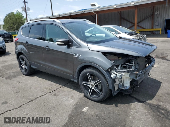 2015 Ford Escape Titanium with VIN 1FMCU9J98FUB49112, listed as a Copart auction lot 58989915 with 94,060 mi miles and Salvage title. Bid and sale history available at DreamBid. Image 4.