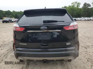 2019 Ford Edge SEL z VIN 2FMPK4J9XKBB10418, wystawiony jako Copart lot #58368335 z przebiegiem 97 458 mil mil oraz Czysty tytuł • Clean title. Historia ofert i sprzedaży dostępna na DreamBid. Obrazek 6.
