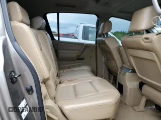 2006 Nissan Armada LE z VIN 5N1AA08B76N710950, wystawiony jako Copart lot #55981715 z przebiegiem 242 233 mil mil oraz Szkoda całkowita • Salvage title. Historia ofert i sprzedaży dostępna na DreamBid. Obrazek 11.