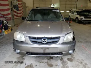 2001 Mazda Tribute LX with VIN 4F2CU08101KM05943, listed as a Copart auction lot 84077694 with 137,937 mi miles and Salvage Title. Bid and sale history available at DreamBid. Image 5.