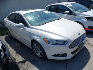 2016 Ford Fusion Titanium Hybrid with VIN 3FA6P0RU1GR259947, listed as a IAAI auction lot 41695377 with 97,605 mi miles. Bid and sale history available at carsss.com. Image 1.