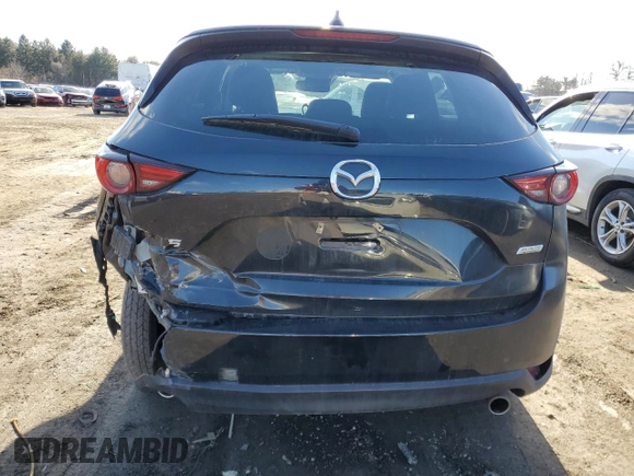 2019 Mazda CX-5 Grand Touring with VIN JM3KFBDM0K0571806, listed as a Copart auction lot 43395105 with 57,768 mi miles and Salvage Title. Bid and sale history available at carsss.com. Image 6.