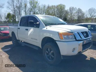 2014 Nissan Titan S with VIN 1N6AA0EC3EN502951, listed as a IAAI auction lot 41956309 with 128,464 mi miles. Bid and sale history available at carsss.com. Image 1.