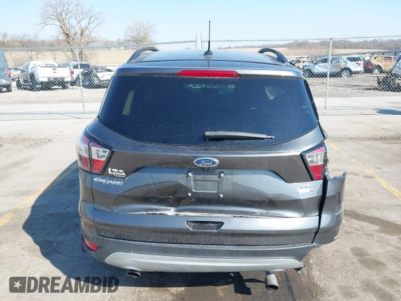 2018 Ford Escape SE z VIN 1FMCU9GD6JUD55937, wystawiony jako IAAI lot #41898592 z przebiegiem 37 800 mil mil oraz . Historia ofert i sprzedaży dostępna na DreamBid. Obrazek 17.